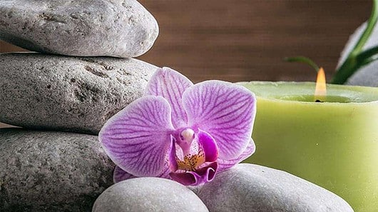 Stones, candles, towels, orchid