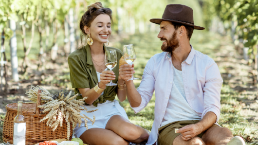 Two people picnicking with wine
