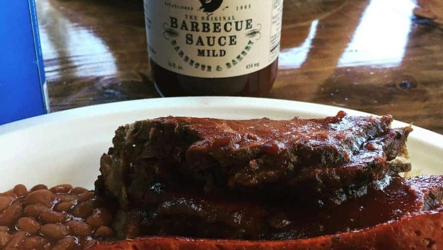 photo of bbq with beans and barbecue sauce on table