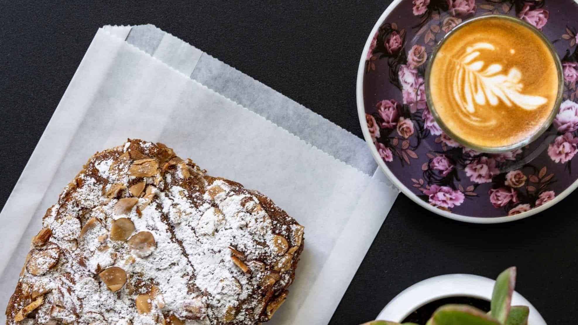 top of table with coffee cup and bread