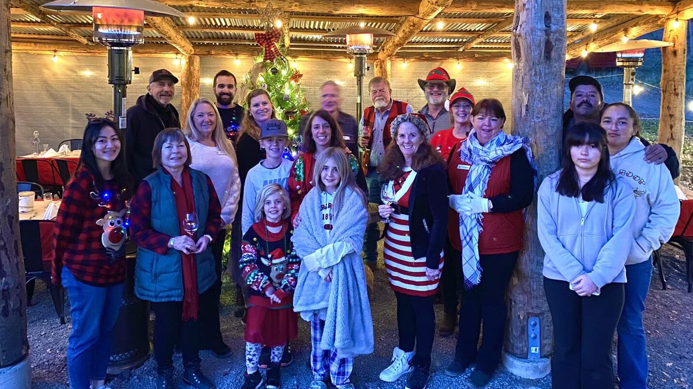 group of people dressed in christmas clothes outside