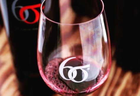 closeup of wine glass with six sigma logo