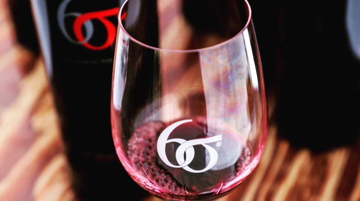 closeup of wine glass with six sigma logo