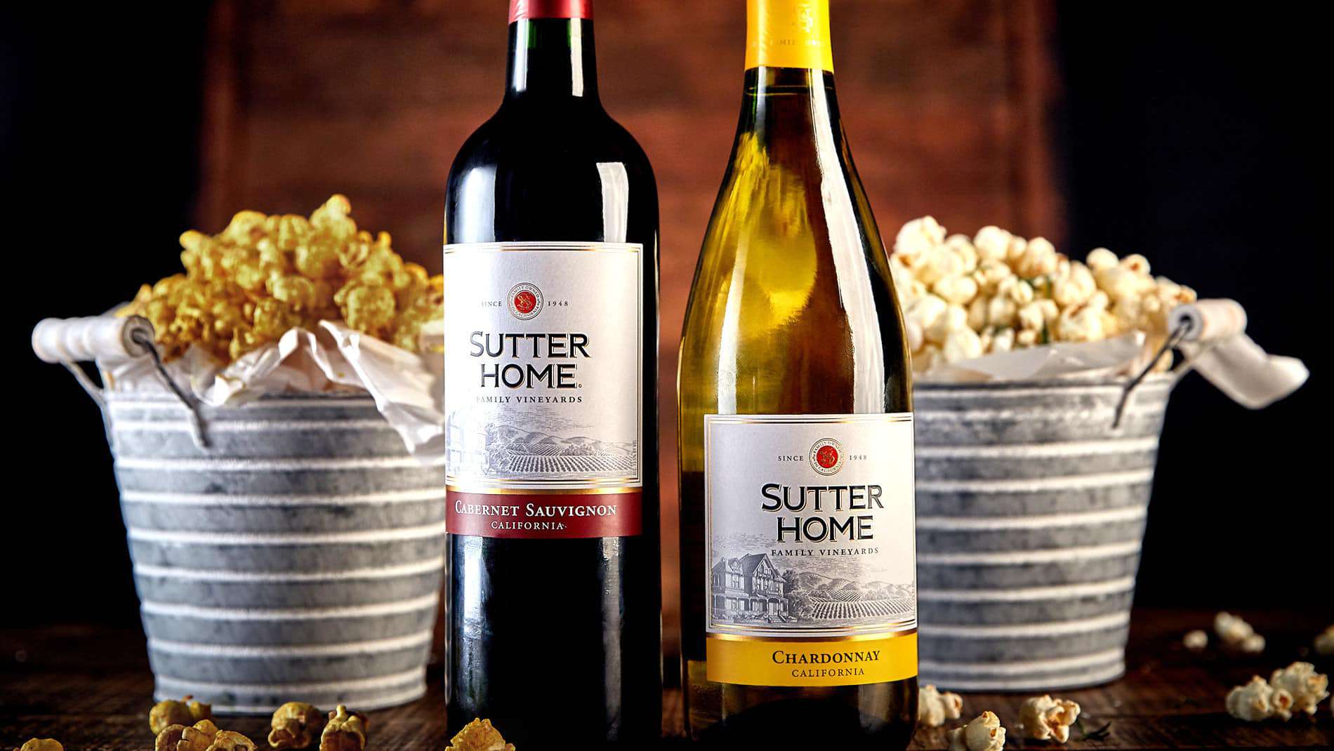 sutter home wine bottles in front of vintage popcorn buckets