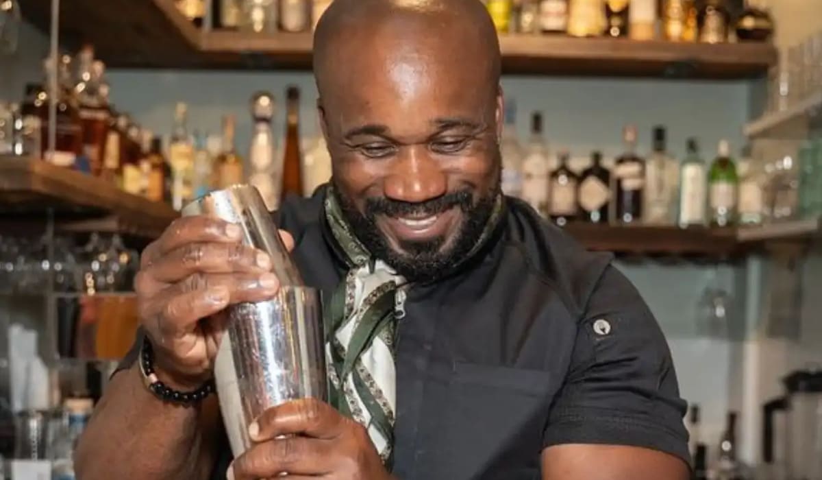 bar man holding cocktail shaker