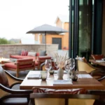 restaurant table with outside patio view behind