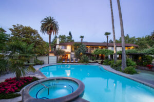 pool with hotel in background