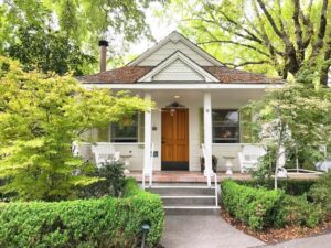 front of white cottage