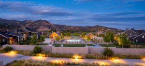 outside pool area of the four seasons hotel with lodges all around