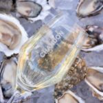 photo of chandon wine glass over oysters