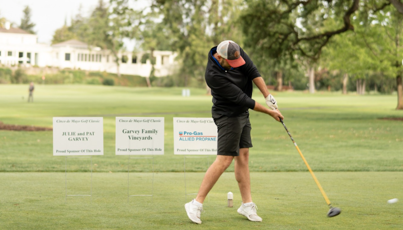 man playing golf at cinco de mayo golf inc