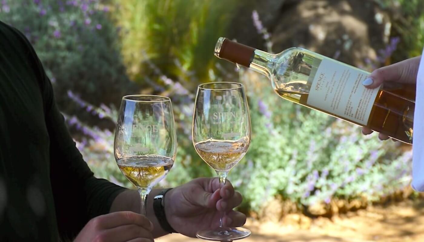 spence rose wine being poured in wine glasses