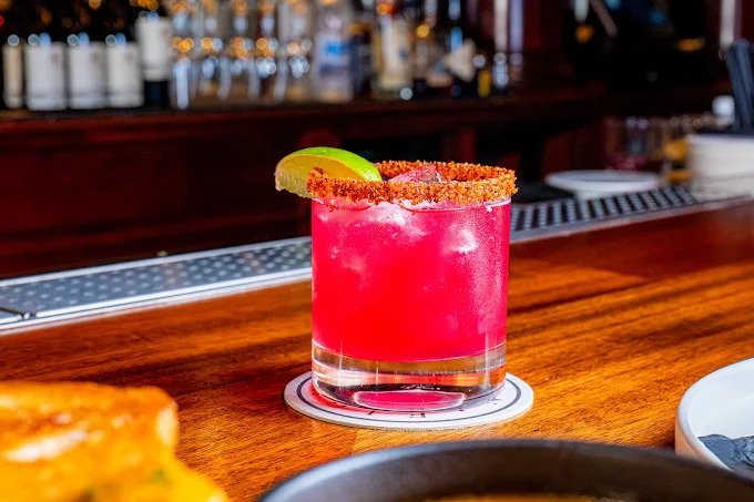cockatil with lime on bar top