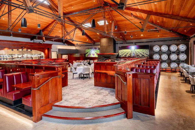 inside of a restairant wiht tables and chairs and elegant seating