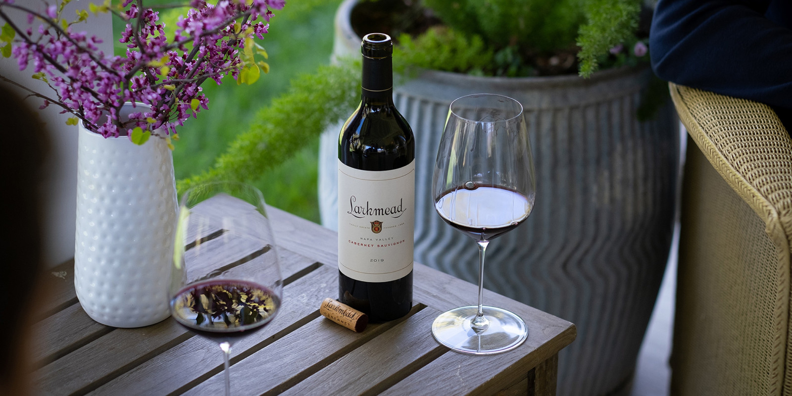 wine bottle and wine glass on table