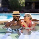 couple sitting on hot tub at roman spa hot springs