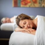 couple relaxing on massage tables