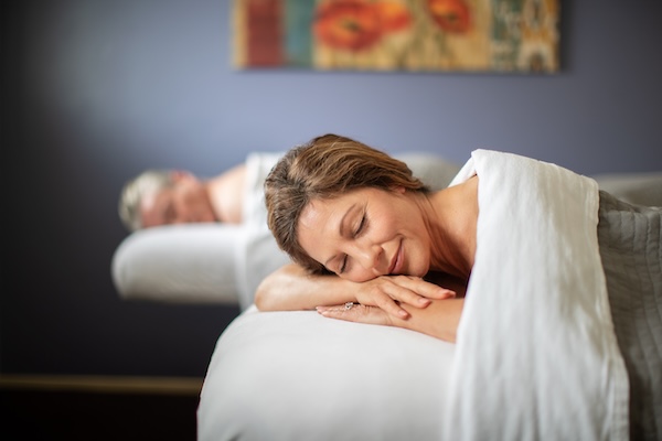 couple relaxing on massage tables